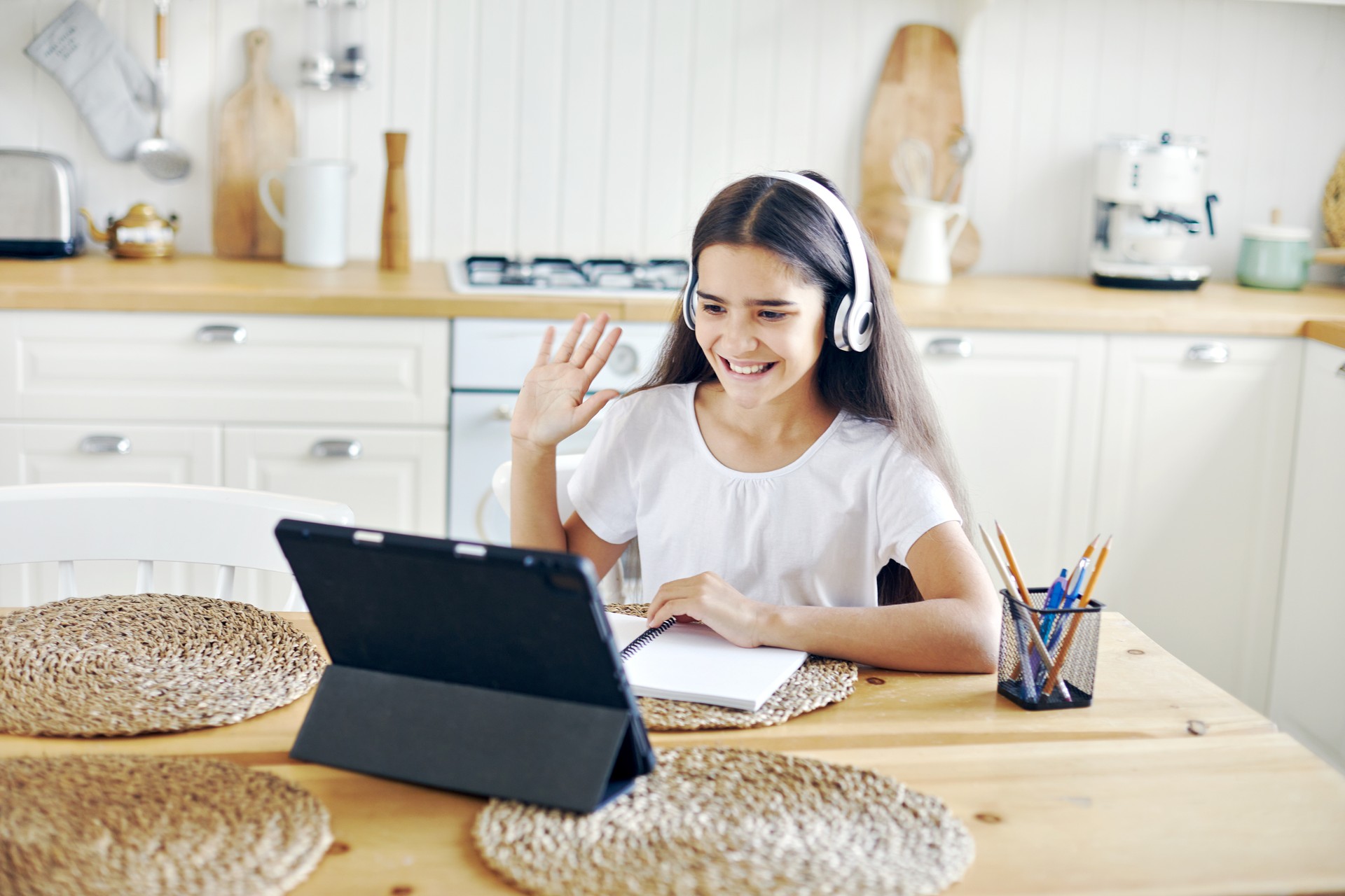 Girl studying online using modern tech at home